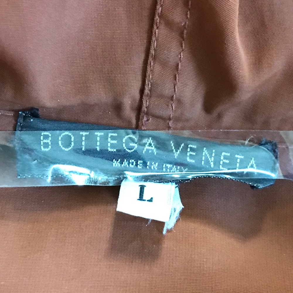 Rust coloured cape.